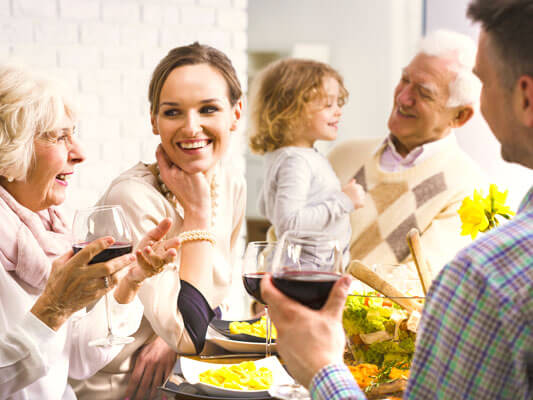 A family enjoys its time together and eats tasty pasta dishes
